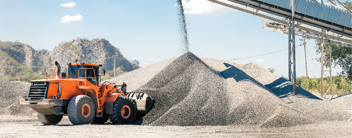 heavy duty vehicle shoveling gravel