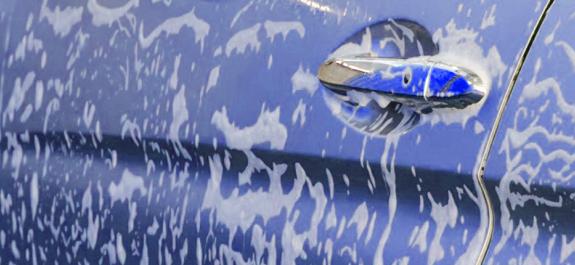 blue car in a car wash service station